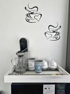 a counter with a blender and two hearts on a wall at Modern Chic CoCo Chanel Inspired * Biz Friendly * Close To All in Hicksville