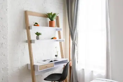 a room with a desk and a chair and a shelf at 24-14 Renovated studio Prime gramercy W D in New York