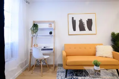 a living room with a couch and a table at 69-3D Prime Lower East East BRAND NEW 1br Apt in New York