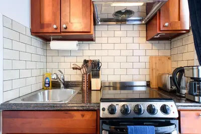 a kitchen with a sink and a stove top oven at 69-5D Modern Lower East East 1br Apt BRAND NEW in New York