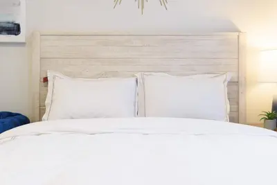 a white bed with white sheets and pillows at 240-11 NEW STUDIO Prime Upper East W&D in New York