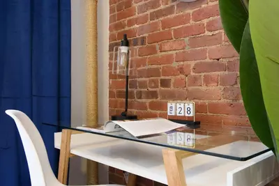 a glass table in front of a brick wall at 240-11 NEW STUDIO Prime Upper East W&D in New York