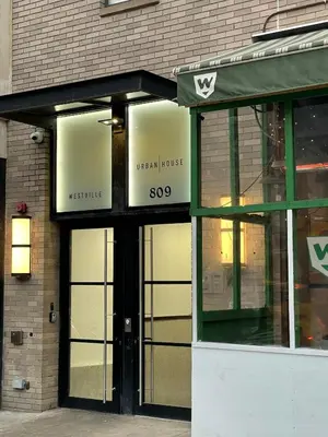 a store front of a building with a green awning at 809-3A 1BR Columbus Circle Elevator W D in New York