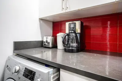 a kitchen counter with a tea kettle and a microwave at 809-3B Columbus Circle W D new BLDG Balcony in New York