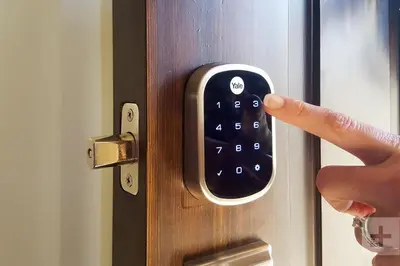 a person pressing a door key with their finger at 26-2B Gramercy Large 1BR WD in unit courtyard in New York