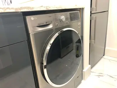 a stainless steel washing machine in a kitchen at 1597-10 New Studio Upper East Side W&D in unit in New York