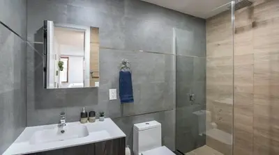 a bathroom with a toilet and a sink and a shower at 1597-11 Studio - Upper East Side Apt W&D in New York