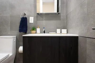 a bathroom with a sink and a toilet at 1597-12 NEW Studio Prime UES WD in unit in New York