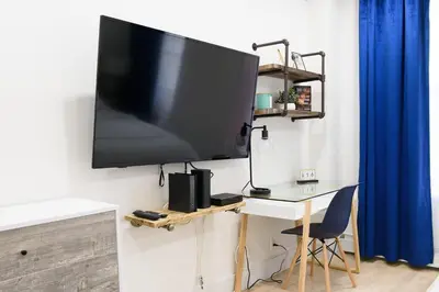 a large flat screen tv hanging on a wall at 1597-12 NEW Studio Prime UES WD in unit in New York