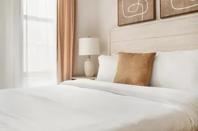 a bedroom with a white bed and a window at 1597-2 Luxury Upper East Side Studio W&D in New York