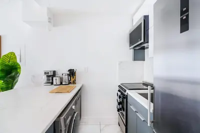 a kitchen with white walls and a white counter top at 1597-4 Brand new Prime UES W D walk to C park in New York