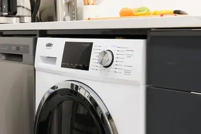 a washer and dryer in a kitchen with a counter at 1597-5 New Studio Prime UES W D in unit in New York