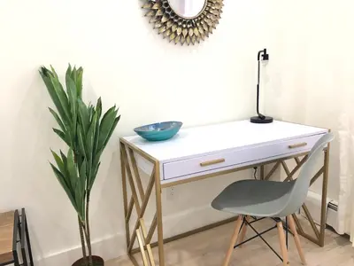 a desk with a chair and a bowl on it at 1597-6 Luxury Studio Upper East Side W&D in New York