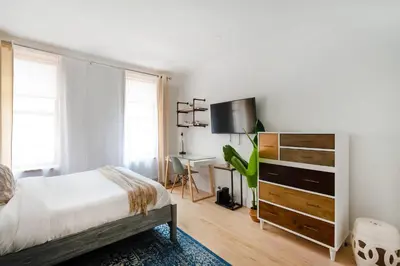 a bedroom with a bed and a desk at 1597-7 Luxury Upper East Studio W&D in unit in New York