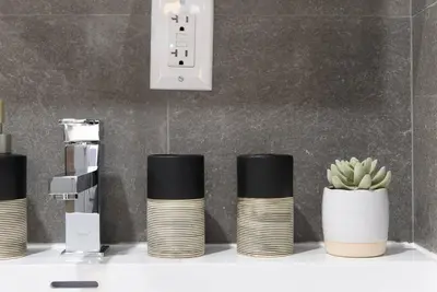 a shelf with a stack ofools and a plant at 1597-8 Luxury STUDIO Upper East Side W&D in New York