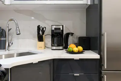 a kitchen with a sink and a bowl of fruit at 78-1A NEW Modern 1BR W&D Walk to Central Park in New York