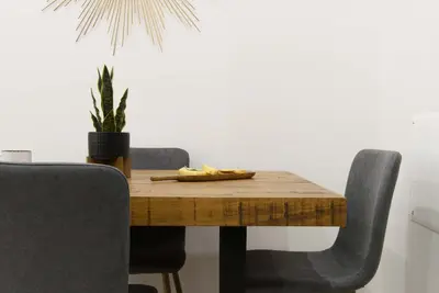 a dining room table with chairs and a plant at 78-1A NEW Modern 1BR W&D Walk to Central Park in New York
