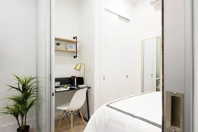 a bedroom with a bed and a desk and a chair at 78-1B New 1BR prime UES WD in unit BEST VALUE in New York