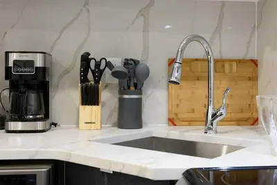 a kitchen counter with a sink and a coffee maker at 78-1B New 1BR prime UES WD in unit BEST VALUE in New York