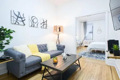 a living room with a couch and a coffee table at 1567-1A New 2br PRIME upper East APT W&D in New York