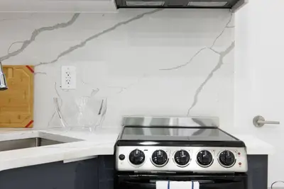 a kitchen with a stove and a counter top at 78-1D NEW Junior 1 BR Prime UES WD in unit in New York