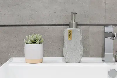 a bottle of soap and a plant on a counter at 78-1D NEW Junior 1 BR Prime UES WD in unit in New York