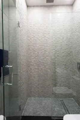 a bathroom with a glass shower with a toilet at 78-1D NEW Junior 1 BR Prime UES WD in unit in New York