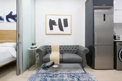 a living room with a couch and a table at 78-2B New furnished 1BR WD walk to Central Park in New York