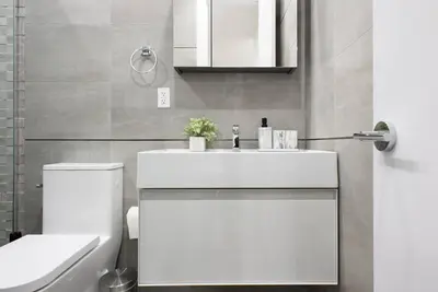 a bathroom with a white sink and a toilet at 78-2B New furnished 1BR WD walk to Central Park in New York