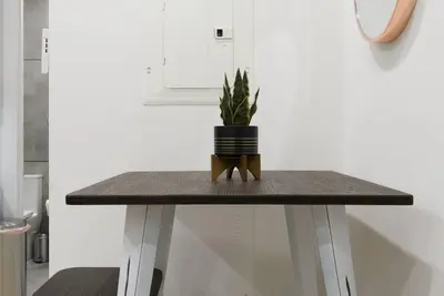 a table with a potted plant on top of it at 78-2B New furnished 1BR WD walk to Central Park in New York