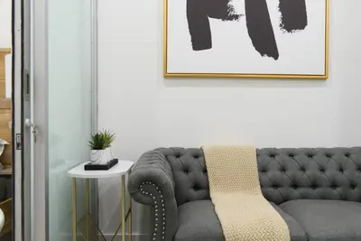 a living room with a gray couch and a table at 78-2B New furnished 1BR WD walk to Central Park in New York