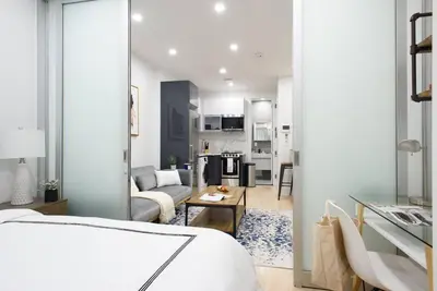 a living room with a couch and a table at 78-2D New furnished 1BR WD walk to Central Park in New York