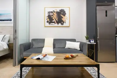 a living room with a couch and a table with fruit on it at 78-2D New furnished 1BR WD walk to Central Park in New York