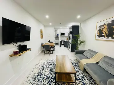 a living room with a couch and a table at 78-3A Luxury BRAND NEW Modern 1BR W&D in New York