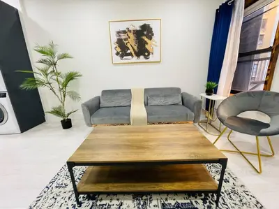 a living room with a couch and a coffee table at 78-3A Luxury BRAND NEW Modern 1BR W&D in New York