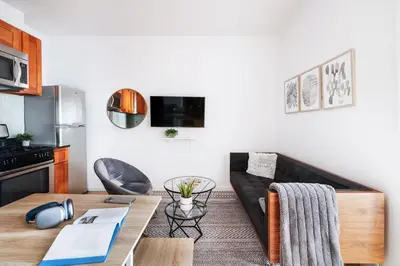 a living room with a couch and a table at 102-1A Best Value 2BR Apt Near Central Park in New York