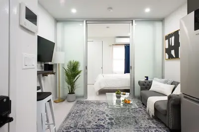 a living room with a couch and a table at 78-3B New Junior 1 BR Prime UES WD in unit in New York