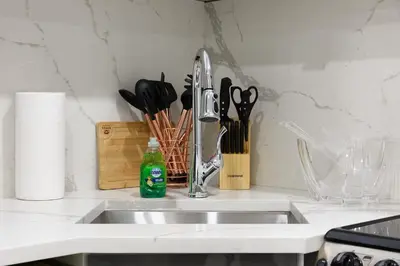 a kitchen counter with a sink and a faucet at 78-3B New Junior 1 BR Prime UES WD in unit in New York