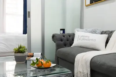 a living room with a couch and a table at 78-3B New Junior 1 BR Prime UES WD in unit in New York