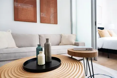 a living room with a table with bottles on it at 78-4B NEW Quality 1br W&D in unit SKYLIGHTS in New York