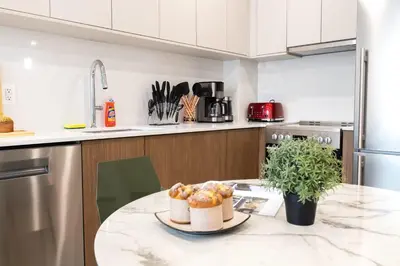 a kitchen with a table with two pastries on it at 149BK-302 New Construction 1BR WD in unit Balcony in Brooklyn