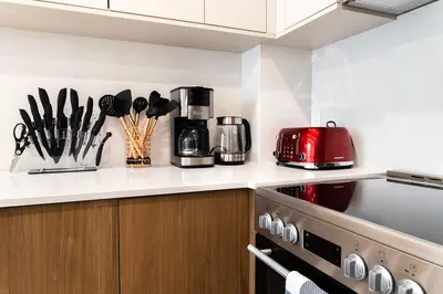 a kitchen with a counter top with a red appliance at 149BK-302 New Construction 1BR WD in unit Balcony in Brooklyn