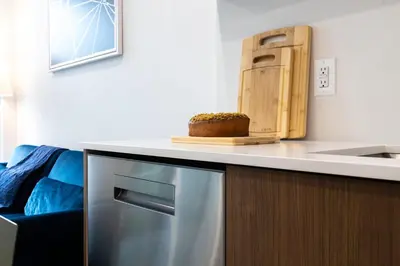 a kitchen counter with a refrigerator and a sink at 149BK-302 New Construction 1BR WD in unit Balcony in Brooklyn