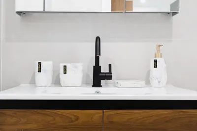 a kitchen counter with a sink and three cups at 149BK-302 New Construction 1BR WD in unit Balcony in Brooklyn