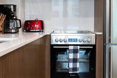 a kitchen with a stove and a red appliance at 149BK-302 New Construction 1BR WD in unit Balcony in Brooklyn