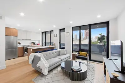 a living room with a couch and a table at 149BK-501 NEW Prime greenpoint 2BR WD in unit in Brooklyn