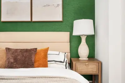 a bedroom with a bed and a lamp on a nightstand at 139-3E west village 1BR best value in New York