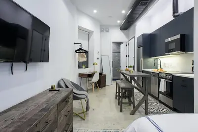 a kitchen with a wooden counter top and a table at 3-1 New Prime East Village Private Terrace in New York