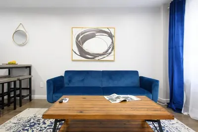 a blue couch in a living room with a coffee table at 350-2A Prime gramercy Newly renovated 1BR sleeps 4 in New York