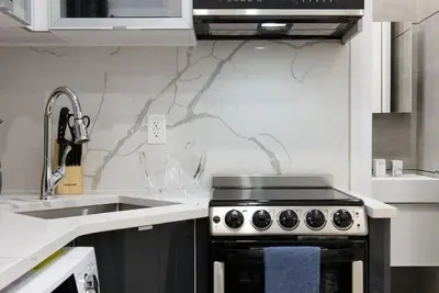 a kitchen with a stove and a sink at 78-4D Quality 1br W&D SKYLIGHT By Central Park in New York